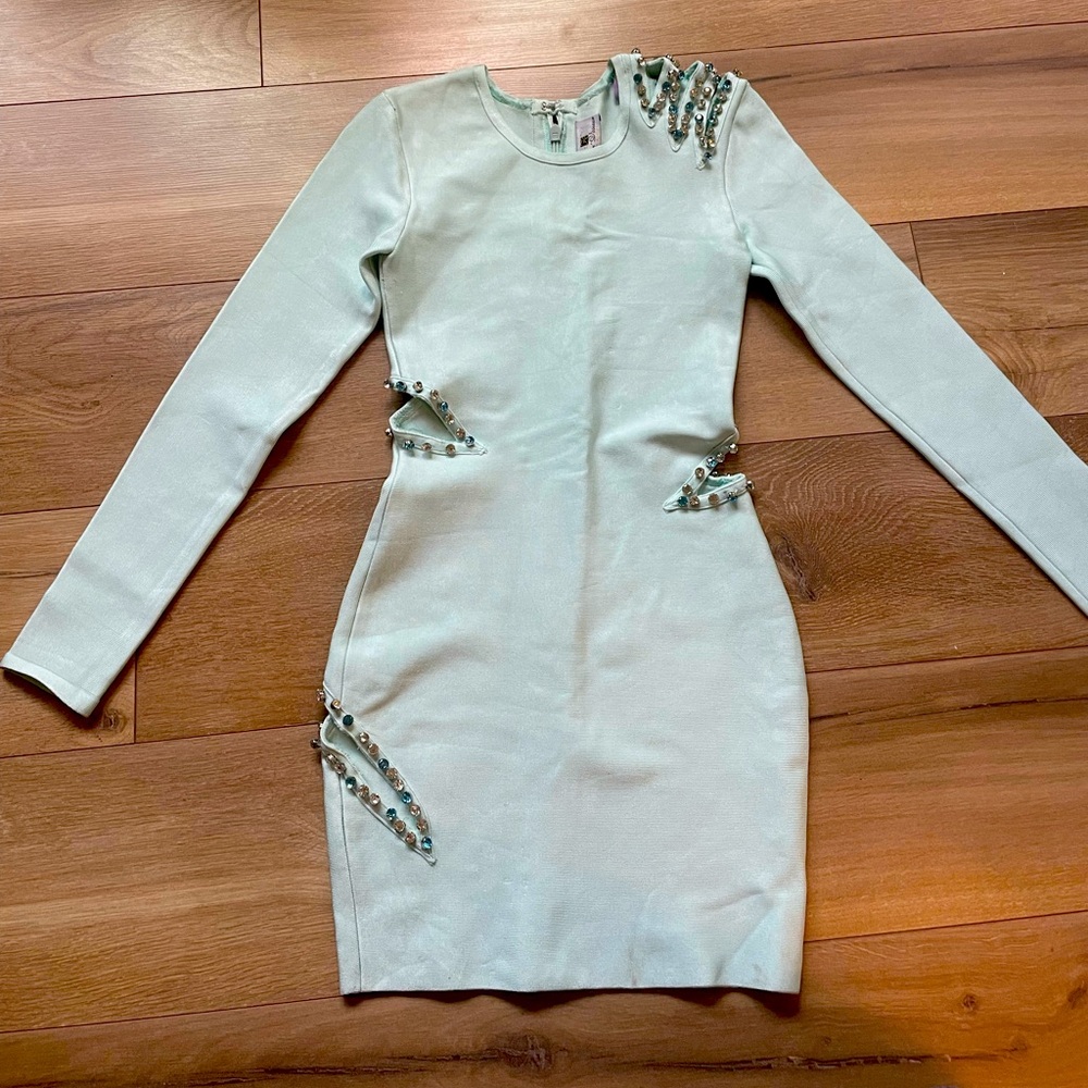 Beautiful dress. Excellent cond. Like new. Missing a couple gems in the back.